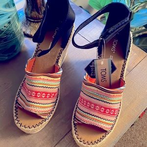 Tom’s wedge sandals. Never worn.